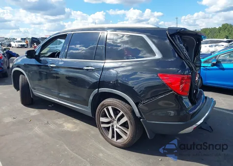 2017 Honda Pilot Touring z USA, uszkodzony, nr VIN 5FNYF5H91HB005559